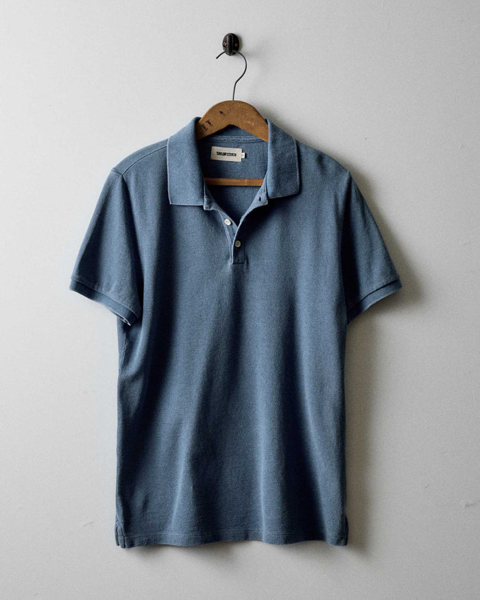 editorial image of The Pacific Polo in Washed Indigo Pique hanging