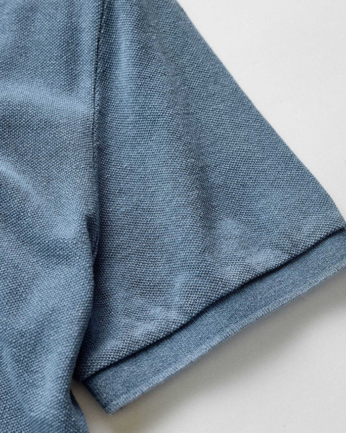 material shot of the sleeve on The Pacific Polo in Washed Indigo Pique