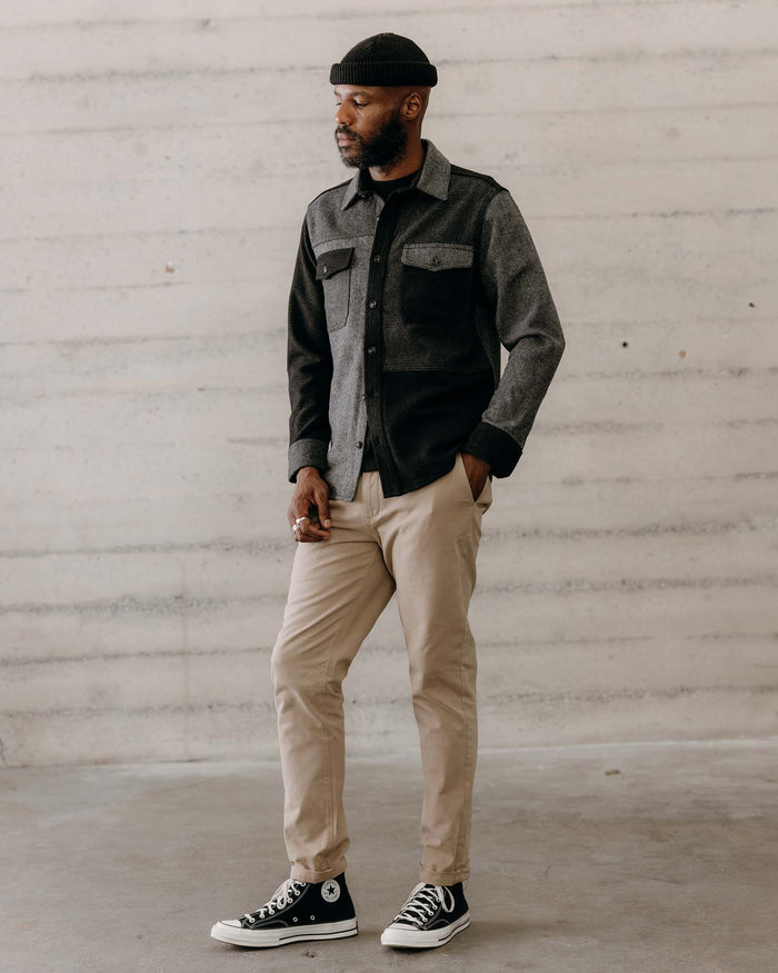 fit model with his hand in his pocket wearing The Patchwork Overshirt in Ash Tweed