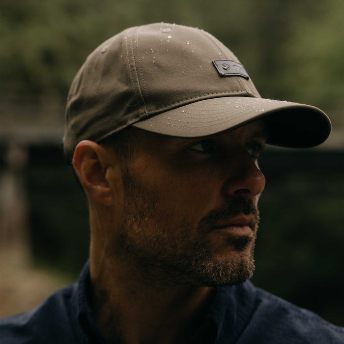 fit model showing off wax finish on The Pathfinder Cap in Fatique Olive Dry Wax