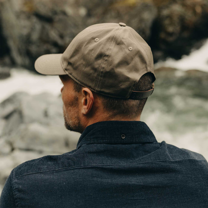 fit model showing off the back of The Pathfinder Cap in Fatique Olive Dry Wax