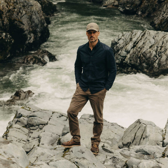 fit model posing in The Pathfinder Cap in Fatique Olive Dry Wax