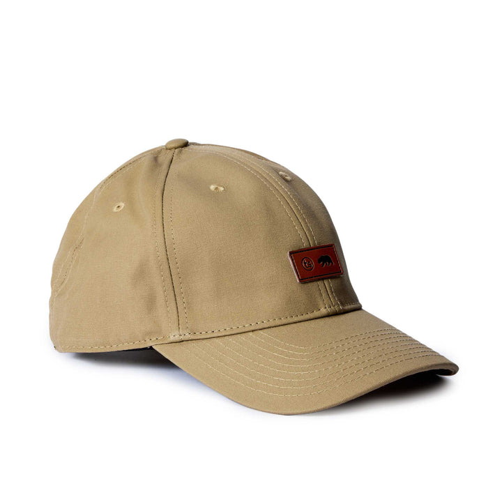 editorial image of the side of The Pathfinder Cap in Khaki Dry Wax