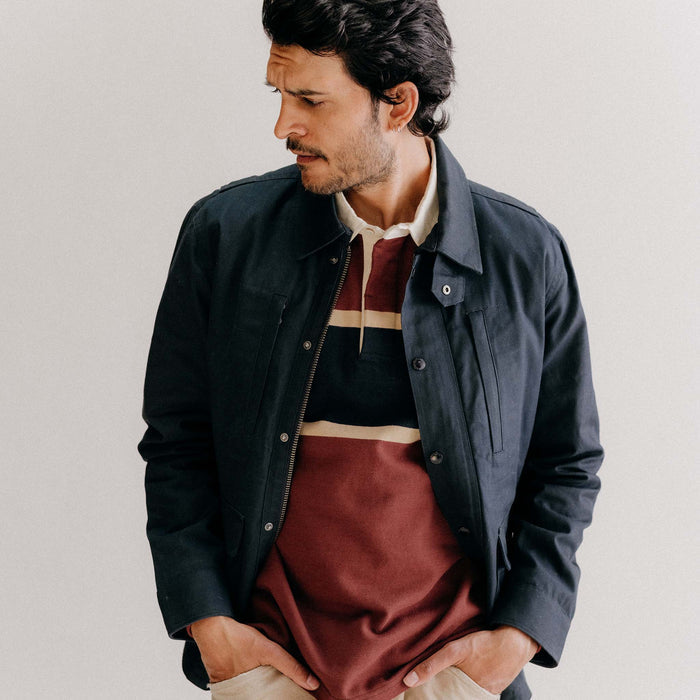 fit model posing in The Pathfinder Waxed Canvas Jacket in Dark Navy Dry Wax