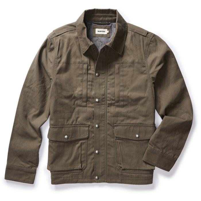 flatlay of The Pathfinder Jacket in Fatigue Olive Dry Wax