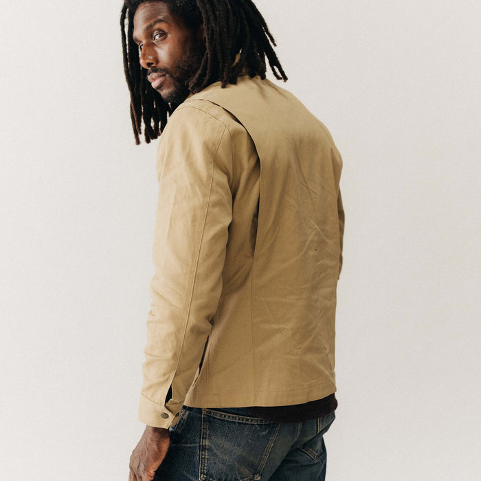 fit model showing off the back of The Pathfinder Jacket in Khaki Dry Wax