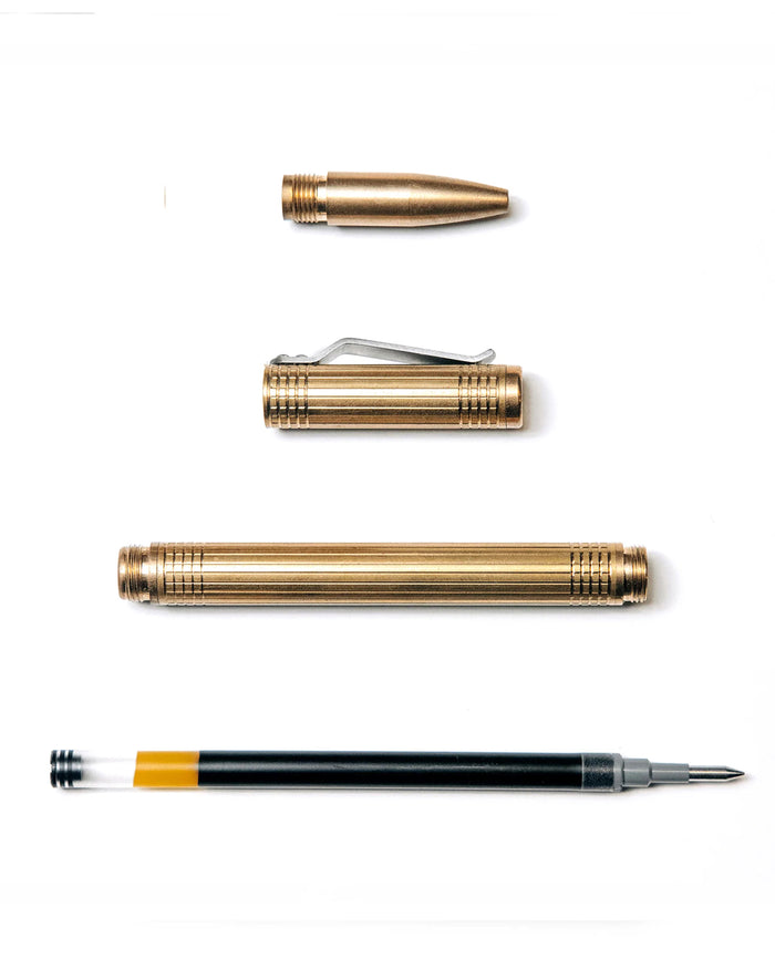 flatlay of The Pen in Brass shown open