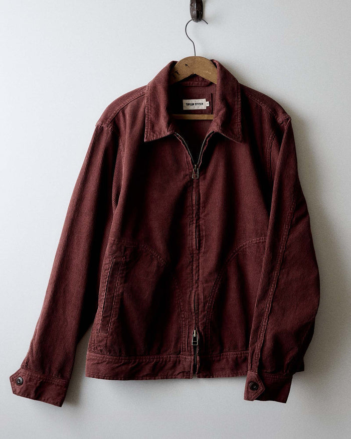 editorial image of The Piston Jacket in Dried Cherry Corduroy hanging