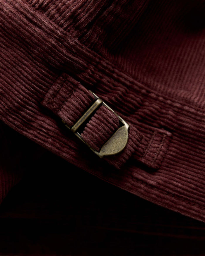 material shot of the buckle on The Piston Jacket in Dried Cherry Corduroy