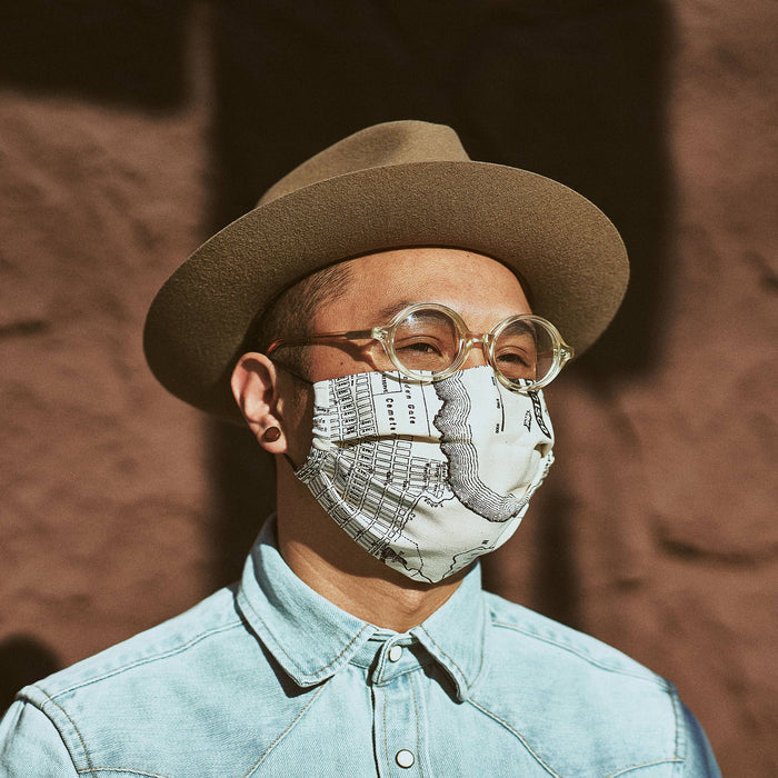 our fit model wearing The Pleated Mask in SF Map Print—cropped shot of face looking right