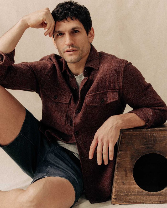 fit model sitting wearing The Point Shirt in Burgundy Linen Tweed