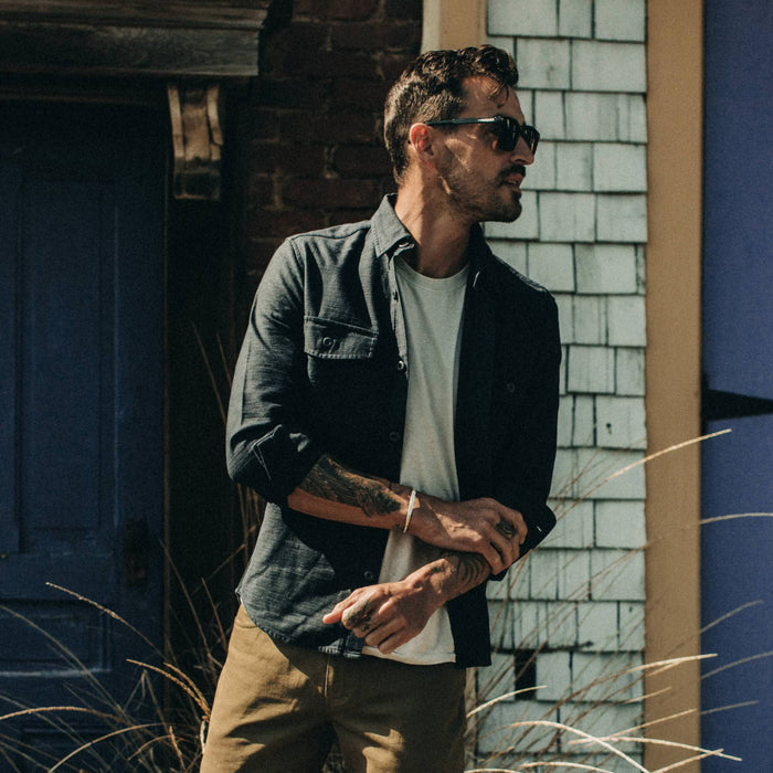 fit model wearing The Point Shirt in Navy Reverse Sateen, looking right, paired over a white t-shirt
