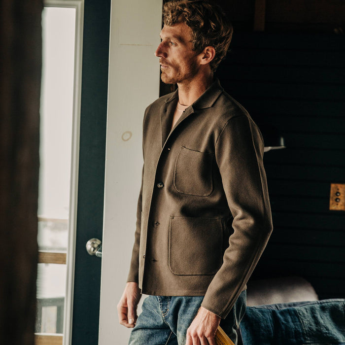 fit model wearing The Prout Jacket in Turkish Coffee, looking out of door
