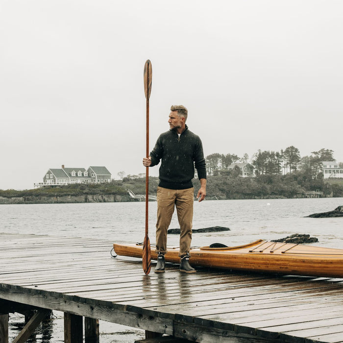 fit model on a dock in the Quarter Zip Tanker Sweater in Loden