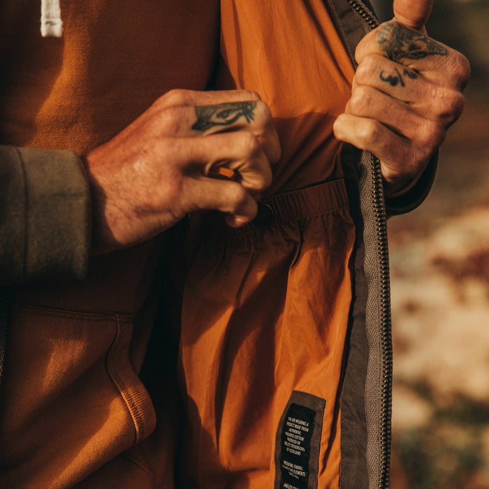 fit model wearing The Quilted Bomber Jacket in Espresso, interior