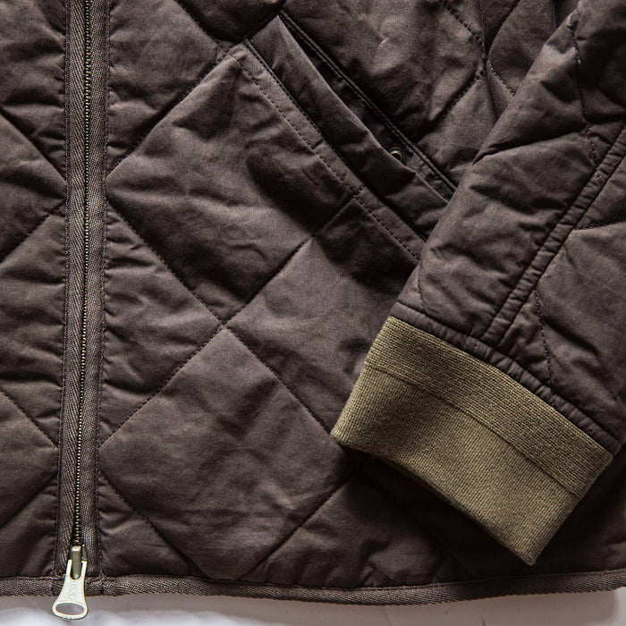 material shot of The Quilted Bomber Jacket in Espresso, front pocket and sleeve
