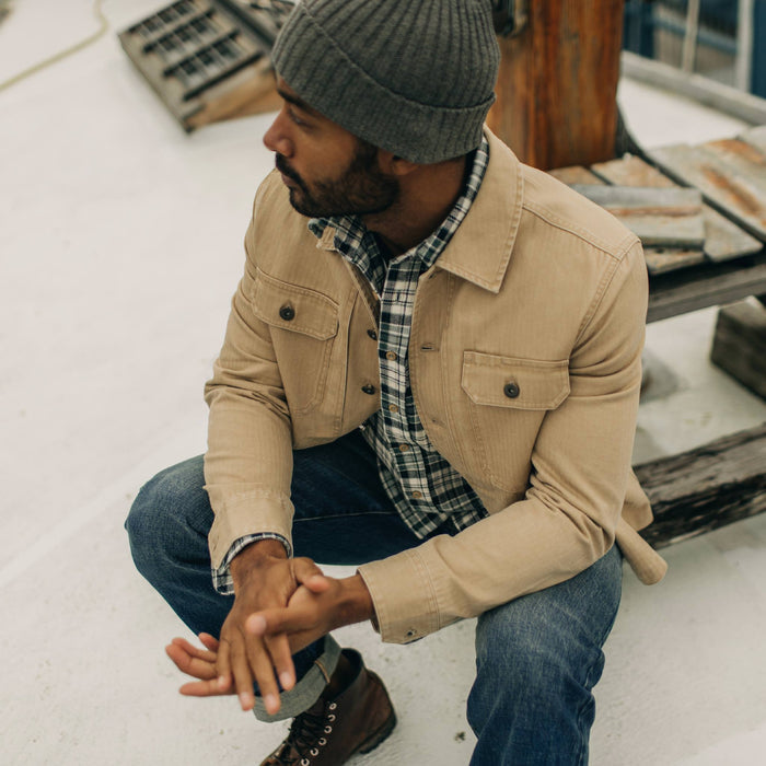 fit model with hands clasped wearing The Reserve Shirt in Khaki Herringbone
