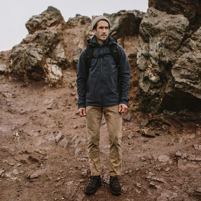 Fit model in weather proof jacket hiking
