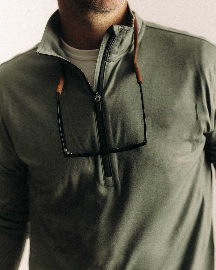fit model showing off The Ridgeline Merino Half Zip in Field Olive