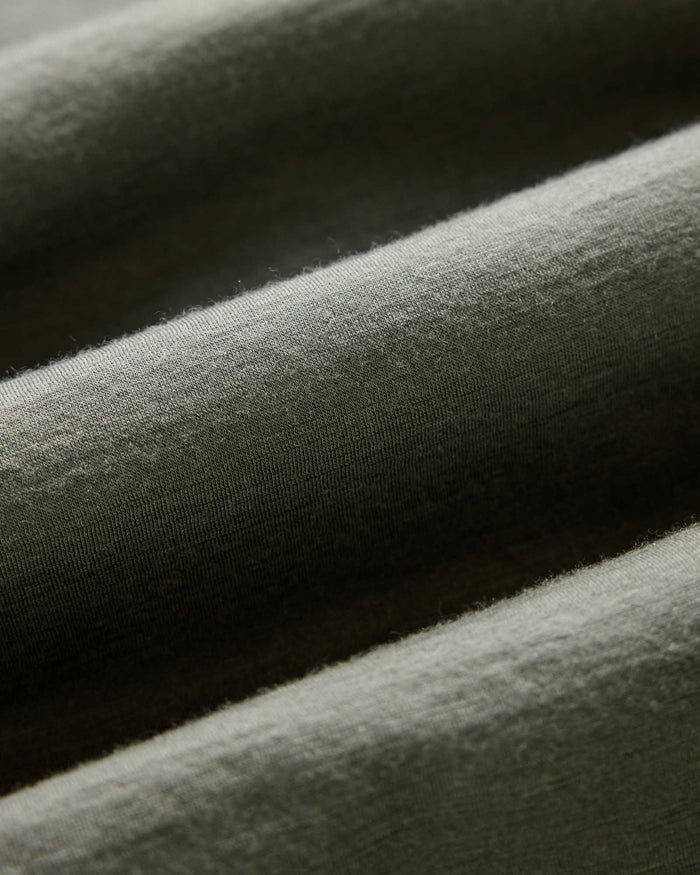 material shot of the fabric on The Ridgeline Merino Half Zip in Field Olive