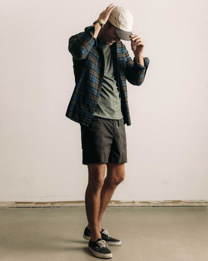 fit model walking wearing The Ridgeline Short in Coal