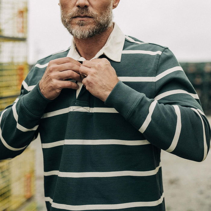 fit model buttoning up The Rugby in Dark Forest Stripe