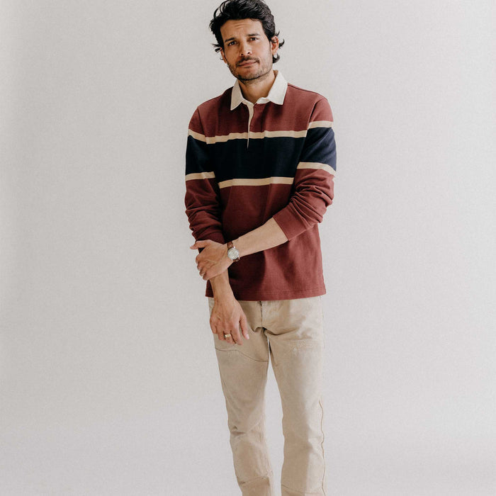 fit model standing wearing The Rugby Shirt in Dried Cherry Stripe