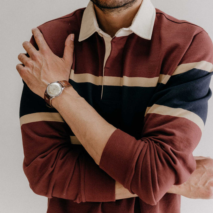 fit model crossing his arms wearing The Rugby Shirt in Dried Cherry Stripe