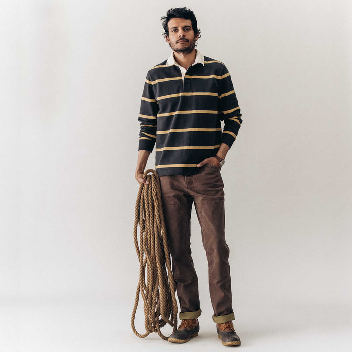 fit model posing in The Rugby Shirt in Faded Black Stripe