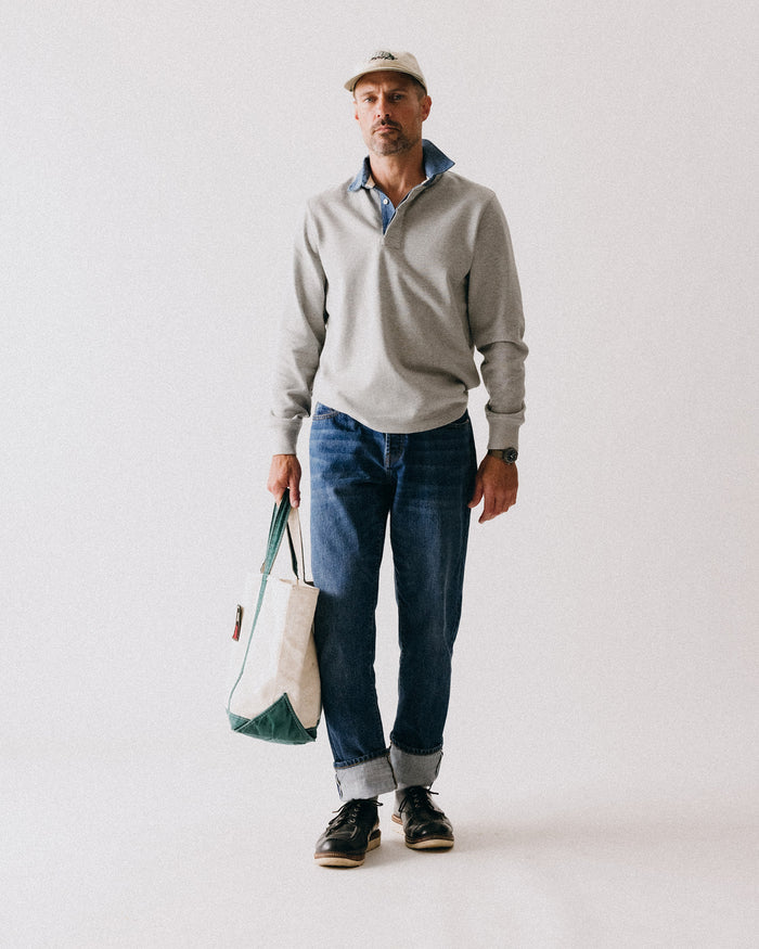 fit model walking wearing The Rugby Shirt in Heather Grey