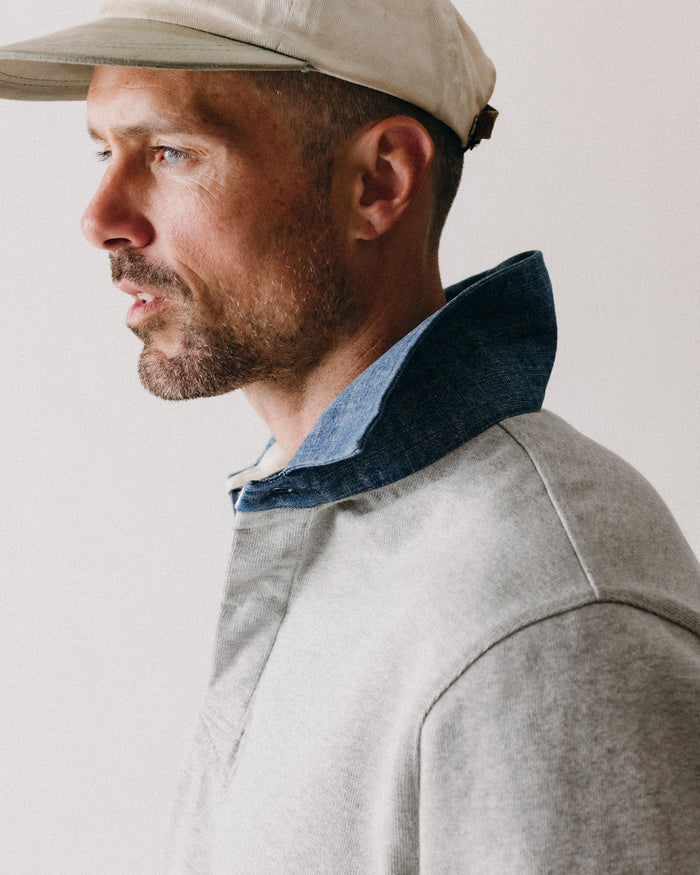 fit model showing off the side of The Rugby Shirt in Heather Grey