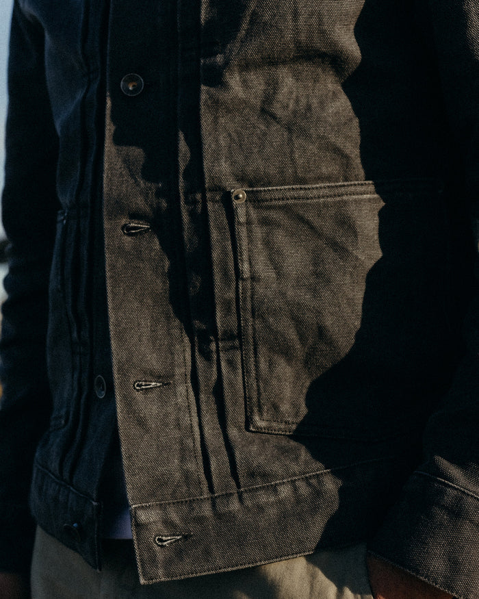 fit model showing off the pocket on The Ryder Jacket in Coal Chipped Canvas