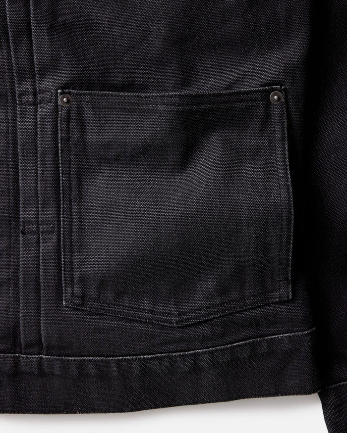 material shot of the pocket on The Ryder Jacket in Coal Chipped Canvas