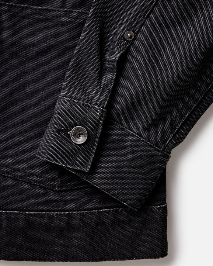 material shot of the cuff on The Ryder Jacket in Coal Chipped Canvas