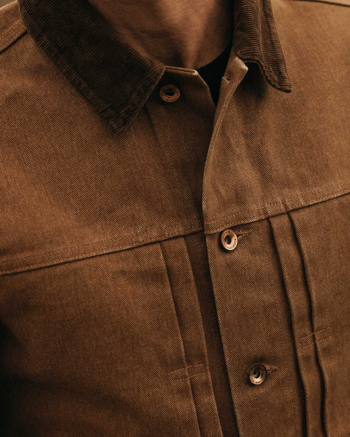 fit model adjusting the collar on The Ryder Jacket in Tobacco Chipped Canvas
