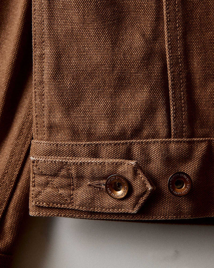 flatlay of The Ryder Jacket in Tobacco Chipped Canvas open