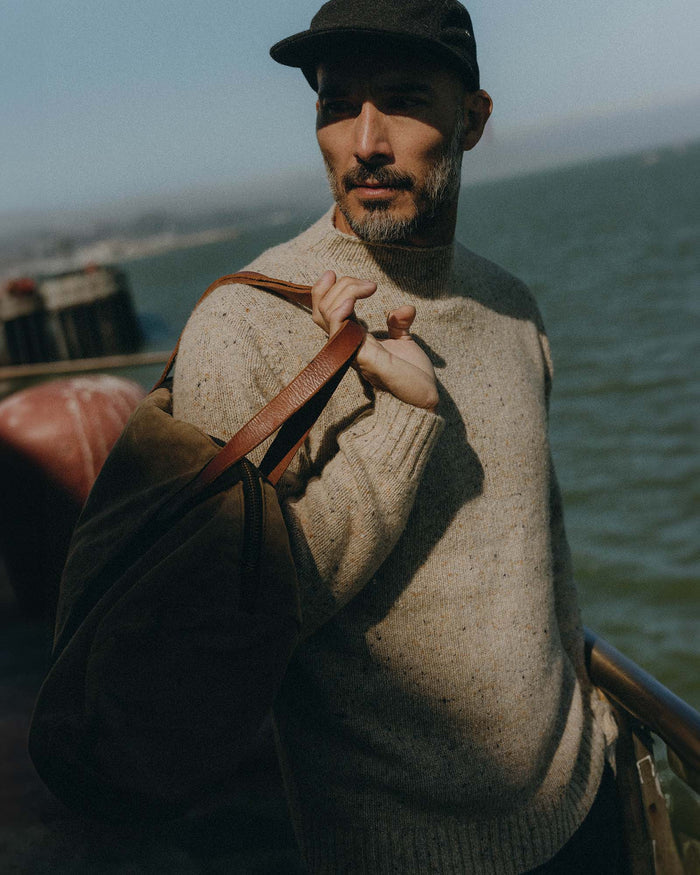 fit model posing in The Seafarer Sweater in Natural Donegal