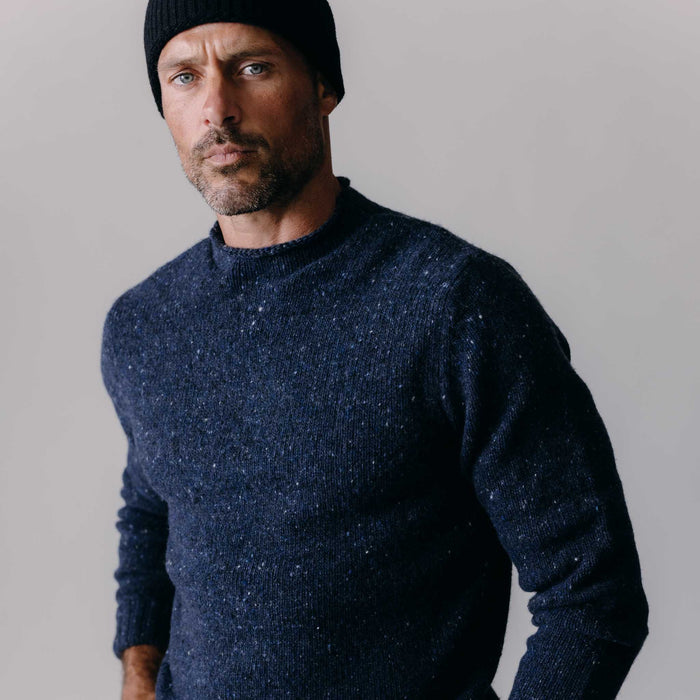 fit model posing in The Seafarer Sweater in Atlantic Blue Donegal