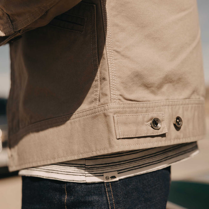 fit model showing off the bottom on The Shifter Jacket in Baked Soil Canvas
