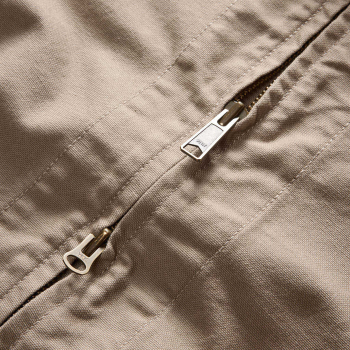 material shot of the two way zipper on The Shifter Jacket in Baked Soil Canvas