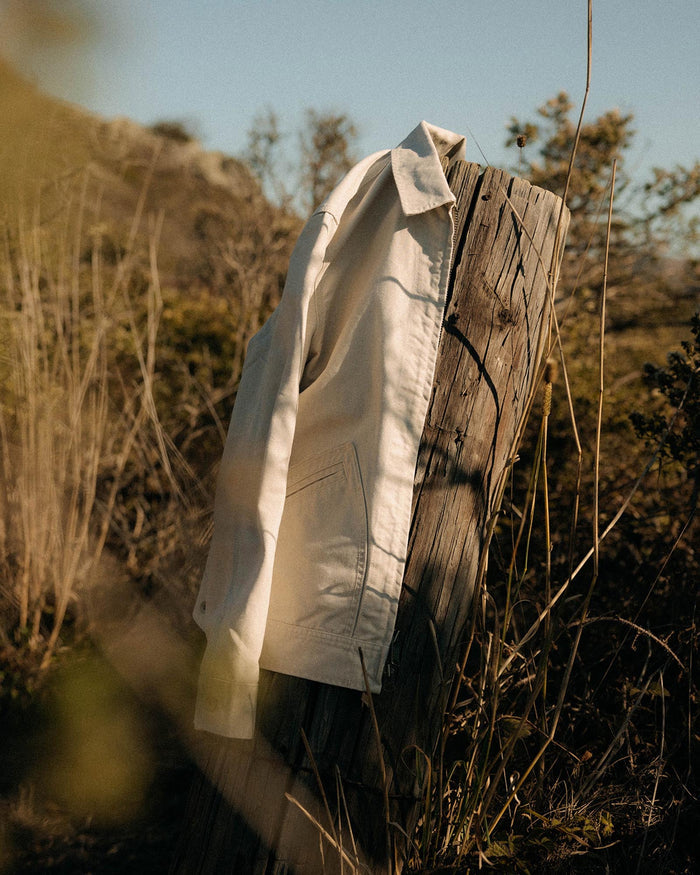 editorial image of The Shifter Jacket in Stone Pigment Canvas on a stick