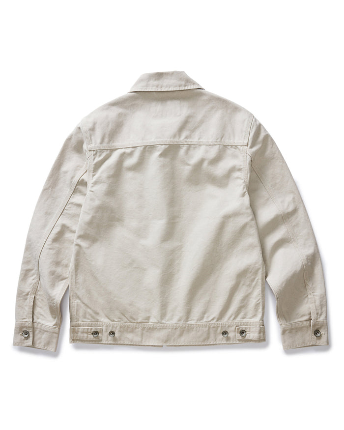 flatlay of the back of The Shifter Jacket in Stone Pigment Canvas