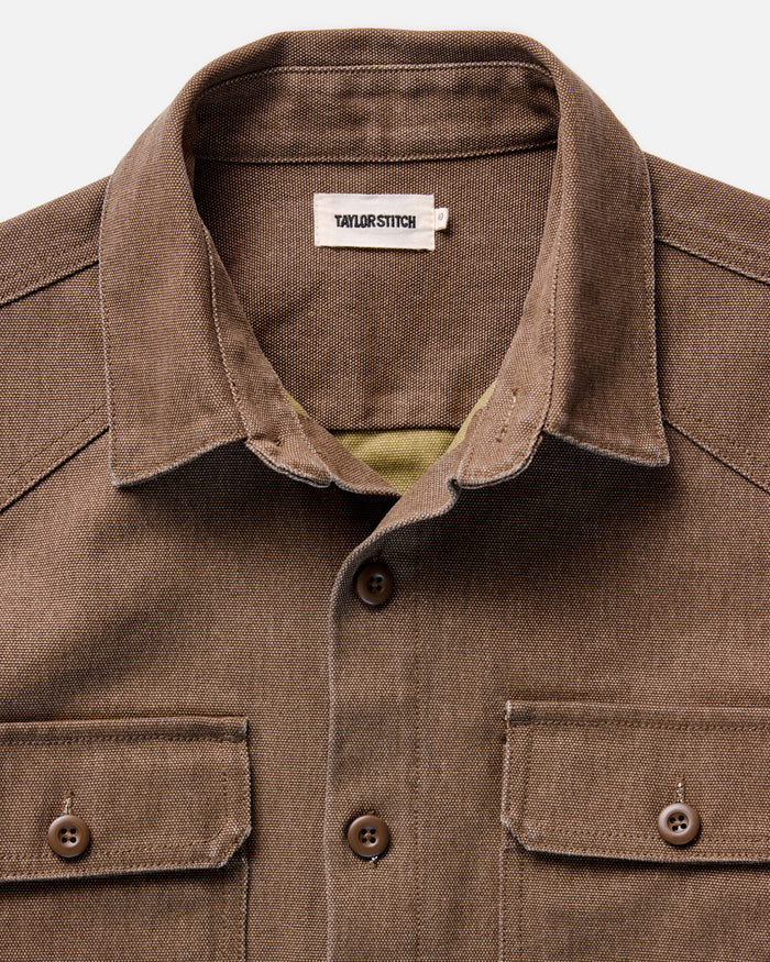 fit model walking wearing The Shop Shirt in Aged Penny Chipped Canvas