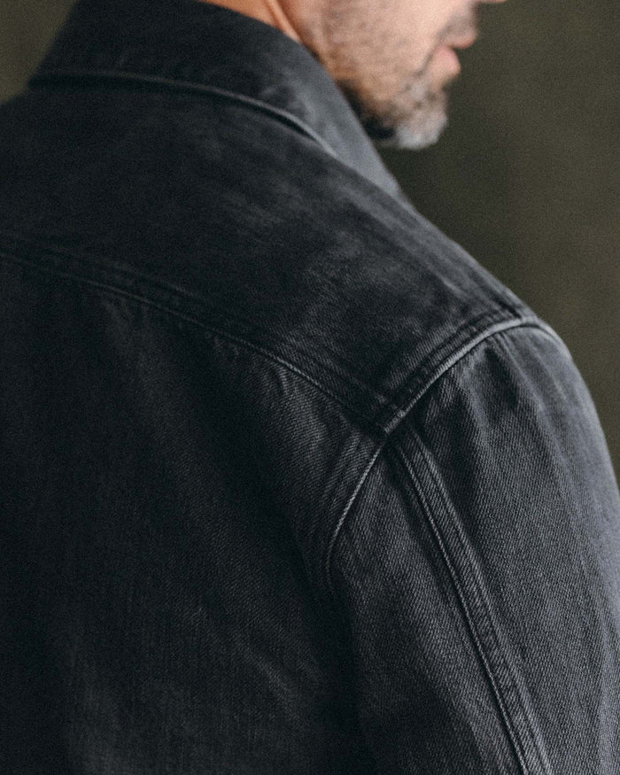 fit model showing off shoulder detail on The Shop Shirt in Washed Black Organic Slub Selvedge