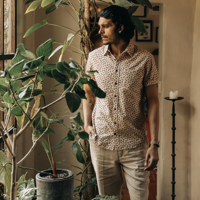 fit model standing by potted plants in The Short Sleeve California in Coastal Flora