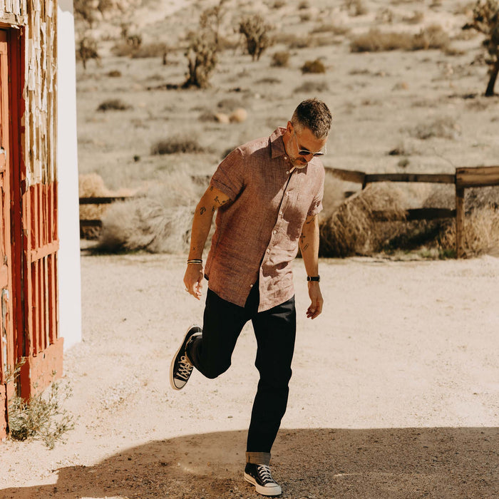 fit model walking wearing The Short Sleeve California in Dried Cherry Hemp