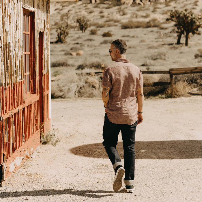 fit model walking wearing The Short Sleeve California in Dried Cherry Hemp
