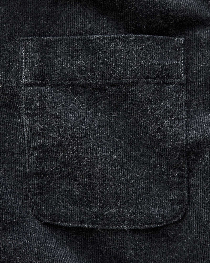 material shot of the pocket on The Short Sleeve California in Heather Coal Cord