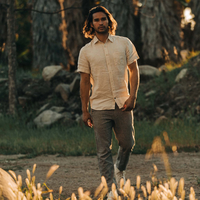 fit model walking in the golden light in The Short Sleeve California in Natural Hemp