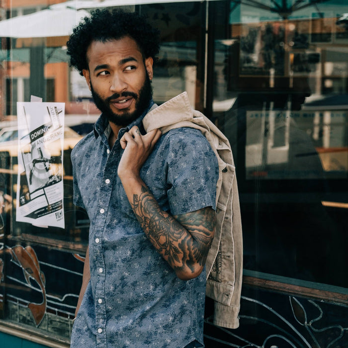 fit model wearing The Short Sleeve California in Ocean Sketch, jacket over shoulder